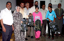 جمعية الرحمة للتنمية الاجتماعية توزع 120 محفظة جمعية الرحمة للتنمية الاجتماعية توزع 120 محفظة